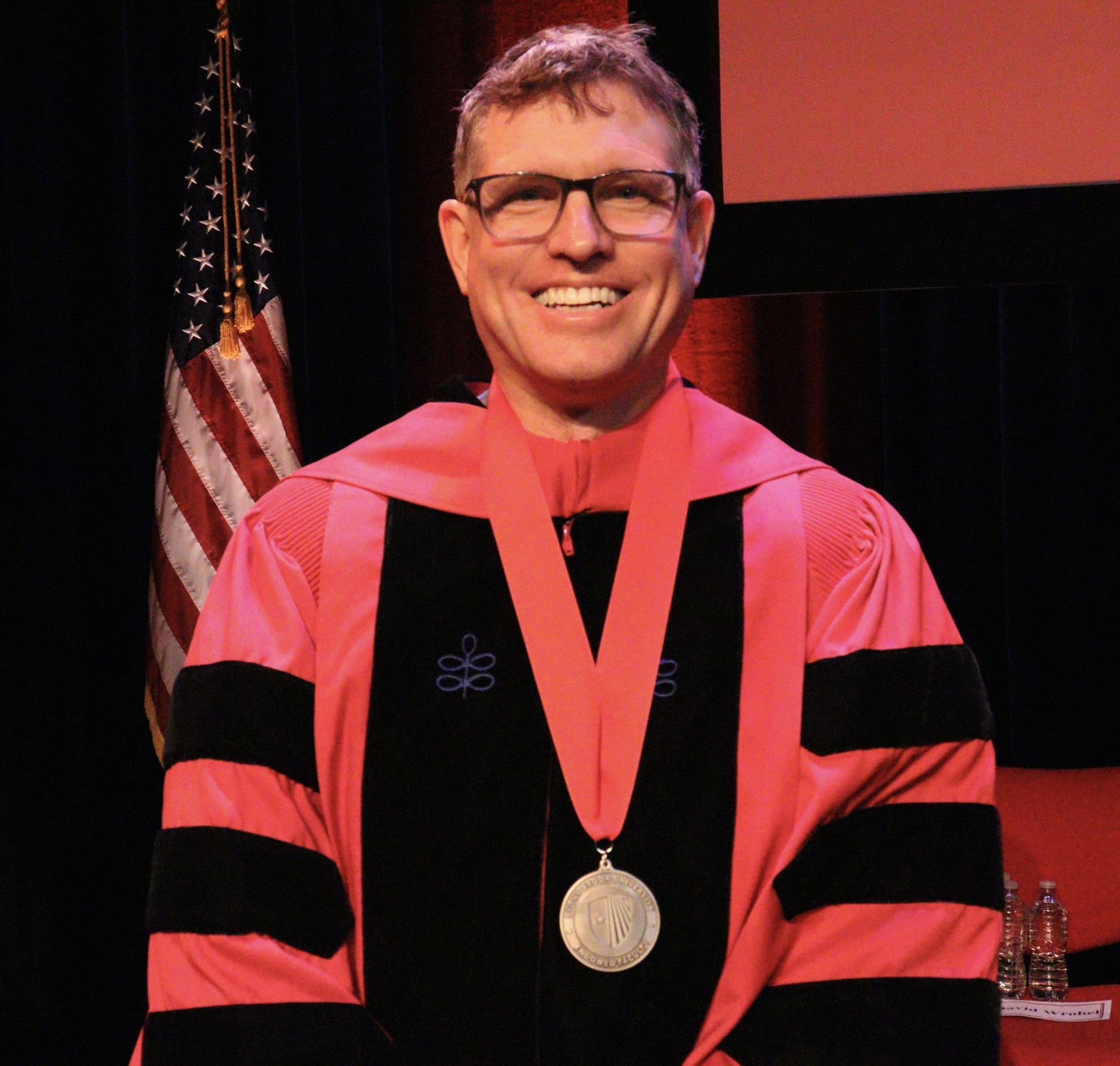 Michael Bender, wearing the medal he received at the Investiture ceremony.