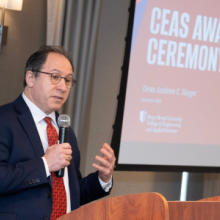 Dean Andrew Singer addresses attendees at the awards ceremony.